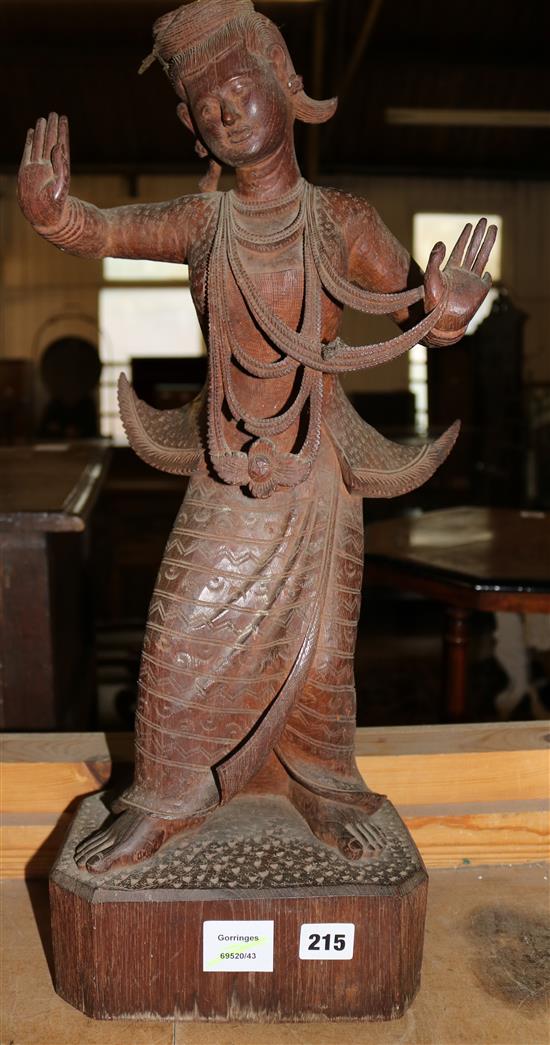 A Balinese carved hardwood figure of a dancer